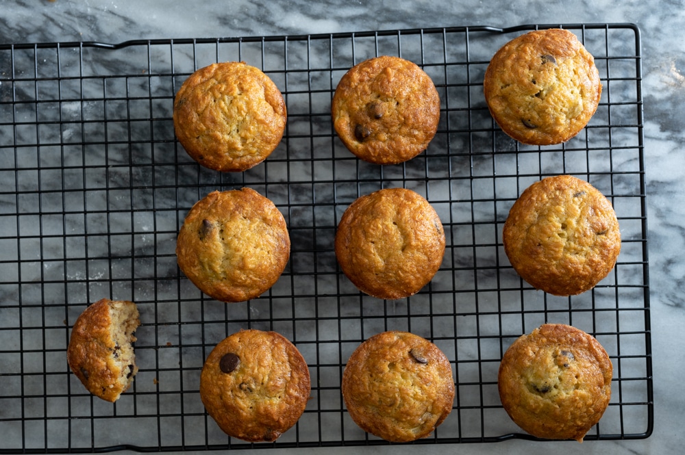 Banana bread muffins cooking on a rack