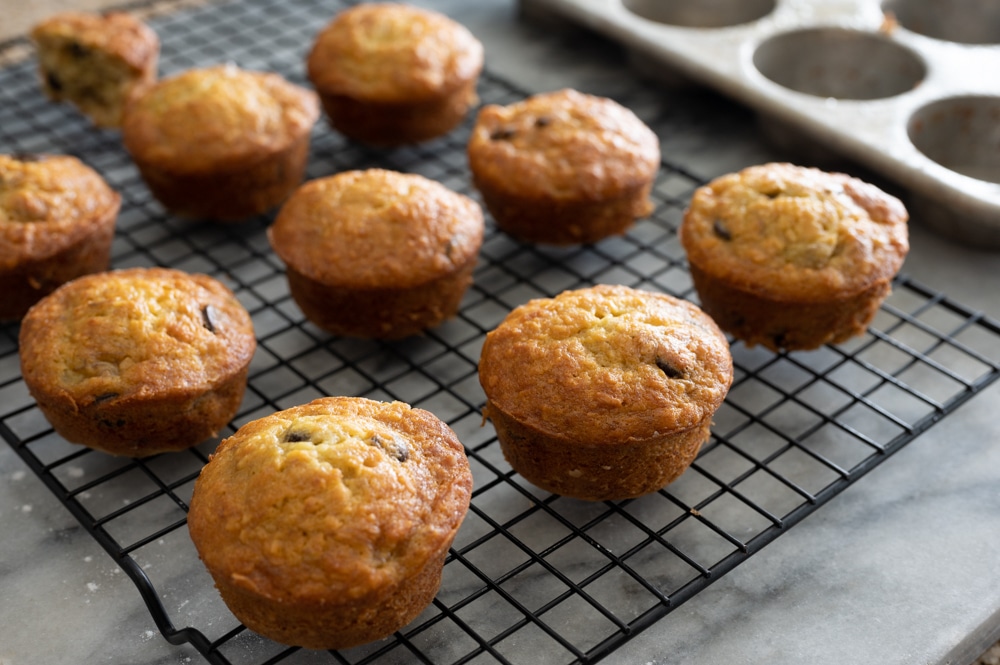 Banana bread muffins cooking on a rack