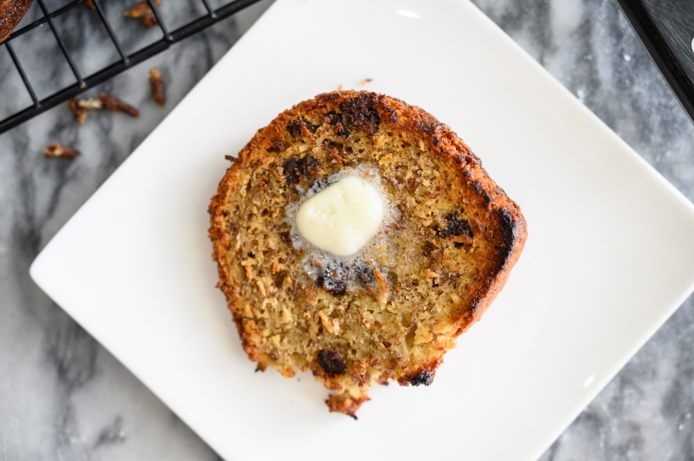 Banana bread with salted butter on a plate